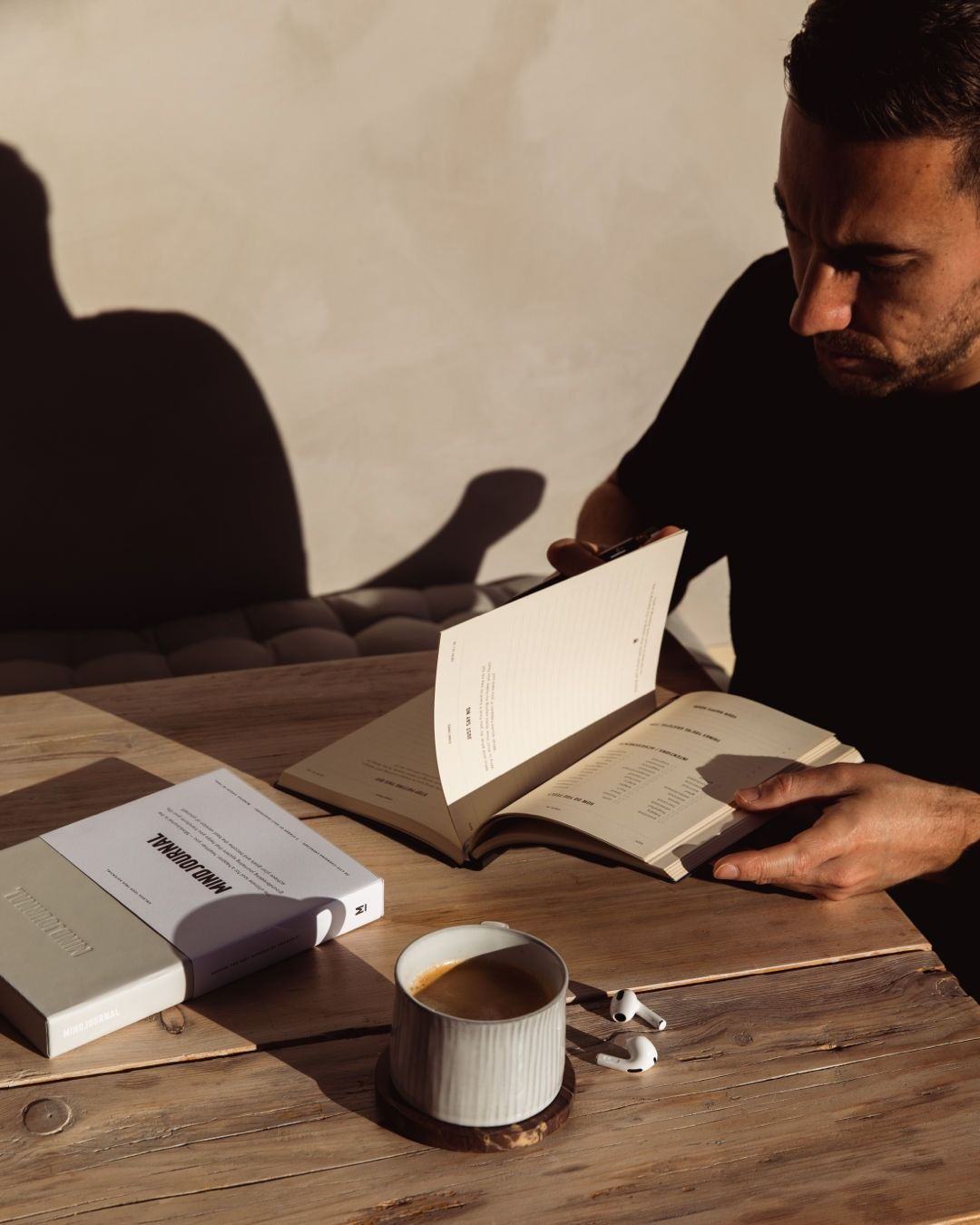 A person reading at a table